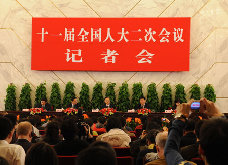 Minister of Commerce Chen Deming (2nd L), Minister of Industry and Information Technology Li Yizhong (3rd L) and Minister of Human Resources and Social Security Yin Weimin (4th L) attend a press conference on 'Boost domestic demand, increase employment and sustain economic growth' held by the Second Session of the 11th National People's Congress (NPC) at the Great Hall of the People in Beijing, capital of China, on March 10, 2009. 