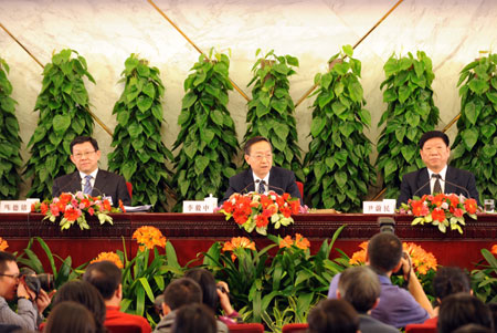 Minister of Commerce Chen Deming (L), Minister of Industry and Information Technology Li Yizhong (C) and Minister of Human Resources and Social Security Yin Weimin attend a press conference on 'Boost domestic demand, increase employment and sustain economic growth' held by the Second Session of the 11th National People's Congress (NPC) at the Great Hall of the People in Beijing, capital of China, on March 10, 2009.