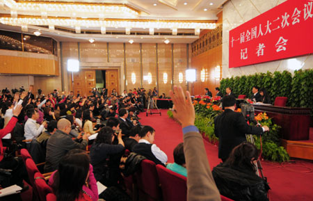 A press conference on 'Boost domestic demand, increase employment and sustain economic growth' held by the Second Session of the 11th National People's Congress (NPC) is held at the Great Hall of the People in Beijing, capital of China, on March 10, 2009. Minister of Industry and Information Technology Li Yizhong, Minister of Human Resources and Social Security Yin Weimin and Minister of Commerce Chen Deming attended the press conference. 