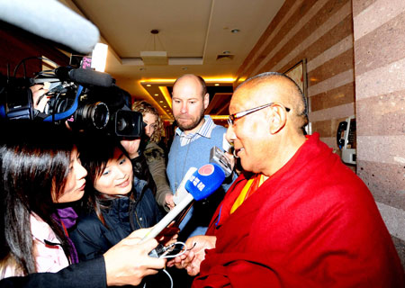 A member of the 11th National Committee of the Chinese People's Political Consultative Conference (CPPCC) receives interview in Beijing, capital of China, March 10, 2009. Members of the 11th National Committee of the CPPCC from the religious circle held a panel discussion on Tuesday.