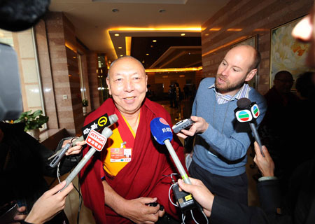 A member of the 11th National Committee of the Chinese People's Political Consultative Conference (CPPCC) receives interview in Beijing, capital of China, March 10, 2009. 