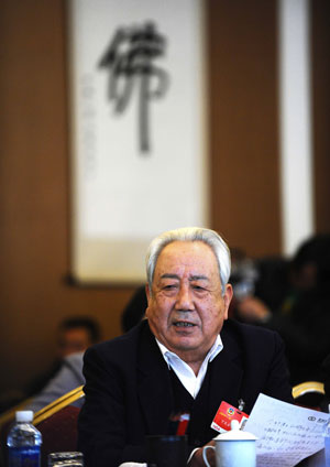 Ding Wenfang, member of the 11th National Committee of the Chinese People's Political Consultative Conference (CPPCC) from the religious circle, speaks during a panel discussion in Beijing, capital of China, March 10, 2009.