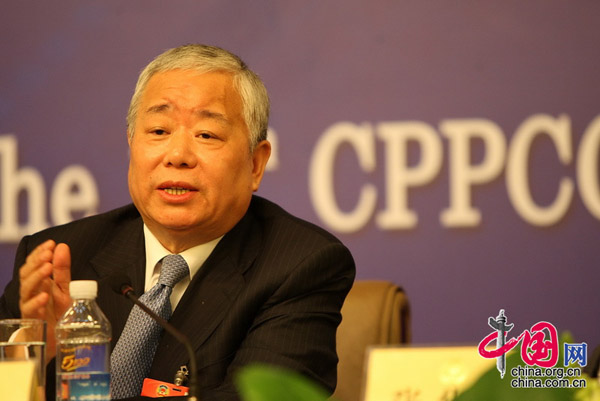 Yan Yanling, member of the 11th National Committee of the Chinese People's Political Consultative Conference (CPPCC), answers questions during a press conference on 'Coping with the Global Financial Crisis' in Beijing, capital of China, on March 10, 2009.