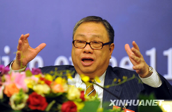 Chen Yongqi, member of the 11th National Committee of the Chinese People's Political Consultative Conference (CPPCC), answers questions during a press conference on 'Coping with the Global Financial Crisis' in Beijing, capital of Chian, on March 10, 2009.