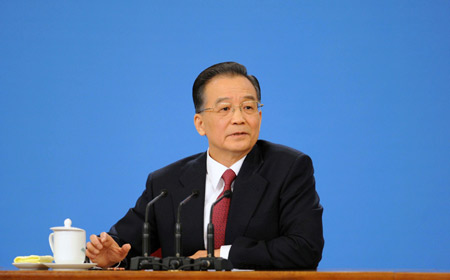Chinese Premier Wen Jiabao answers questions during a press conference after the closing meeting of the Second Session of the 11th National People's Congress (NPC) at the Great Hall of the People in Beijing, capital of China, on March 13, 2009. The annual NPC session closed on Friday. 