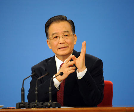 Chinese Premier Wen Jiabao answers questions during a press conference after the closing meeting of the Second Session of the 11th National People's Congress (NPC) at the Great Hall of the People in Beijing, capital of China, on March 13, 2009. The annual NPC session closed on Friday.