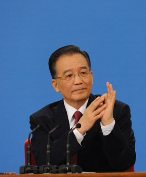 Chinese Premier Wen Jiabao answers questions during a press conference after the closing meeting of the Second Session of the 11th National People&apos;s Congress (NPC) at the Great Hall of the People in Beijing, capital of China, on March 13, 2009. The annual NPC session closed on Friday. 