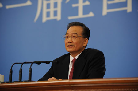 Chinese Premier Wen Jiabao answers questions during a press conference after the closing meeting of the Second Session of the 11th National People&apos;s Congress (NPC) at the Great Hall of the People in Beijing, capital of China, on March 13, 2009. The annual NPC session closed on Friday. 