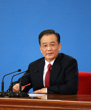 Chinese Premier Wen Jiabao answers questions during a press conference after the closing meeting of the Second Session of the 11th National People's Congress (NPC) at the Great Hall of the People in Beijing, capital of China, on March 13, 2009. The annual NPC session closed on Friday.