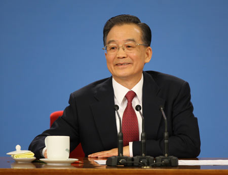 Chinese Premier Wen Jiabao answers questions during a press conference after the closing meeting of the Second Session of the 11th National People's Congress (NPC) at the Great Hall of the People in Beijing, capital of China, on March 13, 2009. The annual NPC session closed on Friday.