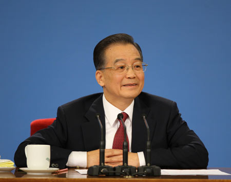 Chinese Premier Wen Jiabao answers questions during a press conference after the closing meeting of the Second Session of the 11th National People's Congress (NPC) at the Great Hall of the People in Beijing, capital of China, on March 13, 2009. The annual NPC session closed on Friday. 