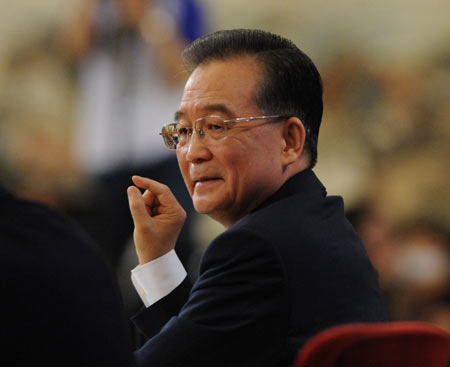 Chinese Premier Wen Jiabao answers questions during a press conference after the closing meeting of the Second Session of the 11th National People's Congress (NPC) at the Great Hall of the People in Beijing, capital of China, on March 13, 2009. The annual NPC session closed on Friday. 