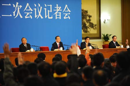 Chinese Premier Wen Jiabao (2nd L) attends a press conference after the closing meeting of the Second Session of the 11th National People's Congress (NPC) at the Great Hall of the People in Beijing, capital of China, on March 13, 2009. The annual NPC session closed on Friday. 