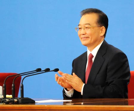 Chinese Premier Wen Jiabao attends a press conference after the closing meeting of the Second Session of the 11th National People's Congress (NPC) at the Great Hall of the People in Beijing, capital of China, on March 13, 2009. The annual NPC session closed on Friday.