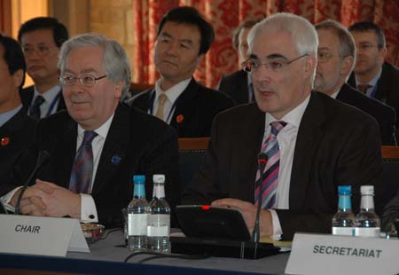 Bank of England Governor Mervyn King (L) and Britain's Finance Minister Alistair Darling attend the opening ceremony of the G20 Finance Ministers' meeting at a hotel near Horsham in southern England on March 14, 2009. 