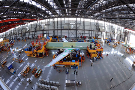 An Airbus A320 plane is assembled at a plant in north China's Tianjin Municipality, on March 23, 2009. Seven A320s are being assembled here. The first plane is scheduled for delivery in June. 