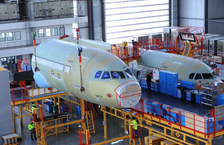 Two Airbus A320 planes are assembled at a plant in north China's Tianjin Municipality, on March 23, 2009. Seven A320s are being assembled here. The first plane is scheduled for delivery in June.