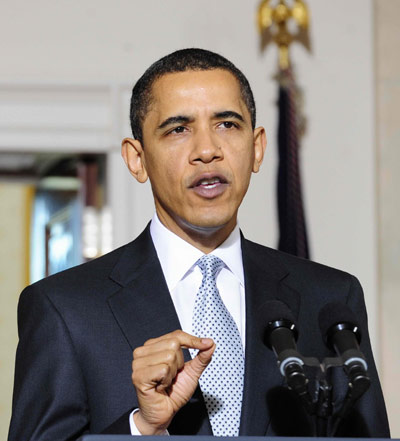 US President Barack Obama makes an announcement about the American automotive industry in the Grand Foyer at white house in Washinton, on March 30, 2009.