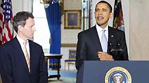 US President Barack Obama (R) speaks about the American automotive industry while Treasury Secretary Timothy Geithner stands by in the Grand Foyer at white house in Washinton, on March 30, 2009.