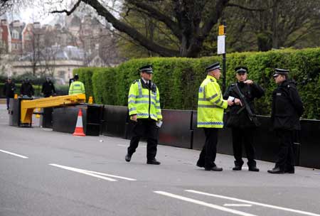 Policemen stand guard on a closed road beside the Winfield House, the official residence of the United States ambassador to Britain where US President Barack Obama will stay during the summit of the Group of 20 Countries (G20), in London on March 31, 2009. 