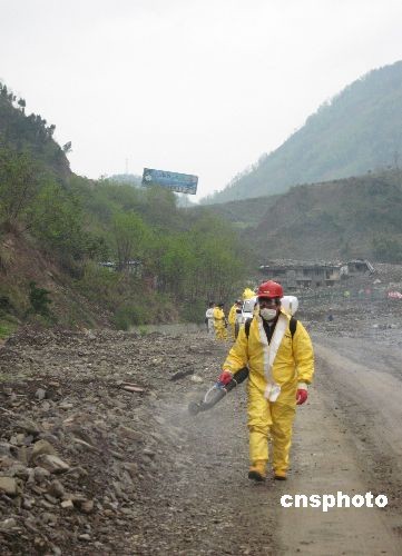Health workers carry out disinfection on the road of Beichuan County seat southwest China's Sichuan Province on Tuesday, on March 31, 2009. 