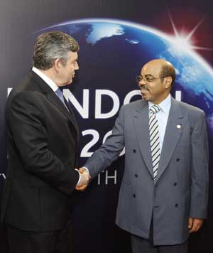 Ethiopia's Prime Minister Meles Zenawi (R) arrives at ExCel center and is greeted by British Prime Minister Gordon Brown for the summit of the Group of 20 Countries (G20) in London on April 2, 2009. 