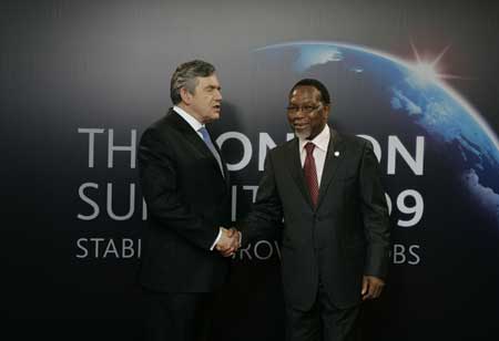 President of South Africa Kgalema Motlanthe (R) arrives at ExCel center, venue of the summit of the Group of 20 Countries (G20), at the start of the conference, in London on April 2, 2009. 