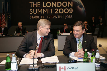 Canada&apos;s Prime Minister Stephen Harper (L) and Finance Minister James Flaherty attend the summit of the Group of 20 Countries (G20) on Financial Markets and World Economy at ExCel center in London on April 2, 2009. The G20 summit is held in London on April 2.