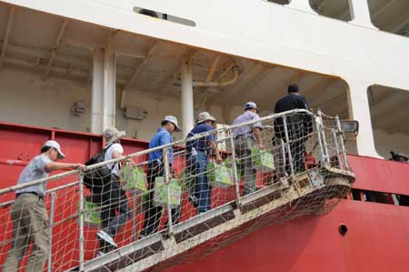 Locals step onto China&apos;s Antarctic exploration vessel the Snow Dragon, or Xuelong in Chinese, at the Kaohsiung Port in southeast China&apos;s Taiwan Province, on April 1, 2009.