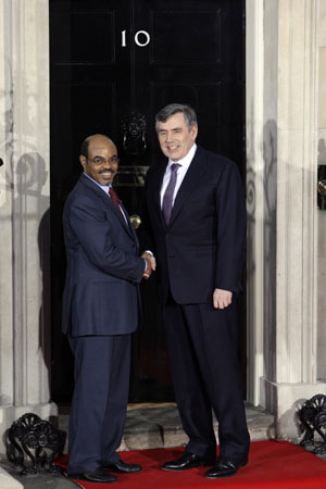 British Prime Minister Gordon Brown (R) shakes hands with Ethiopian Prime Minister Meles Zenawi at No.10 Downing Street in London on April 1, 2009. Brown hosted a working dinner for the leaders attending the Group of 20 Countries (G20) summit at No. 10 Downing Street April 1, 2009. The G20 Summit on Financial Markets and World Economy will be held in London on April 2. 