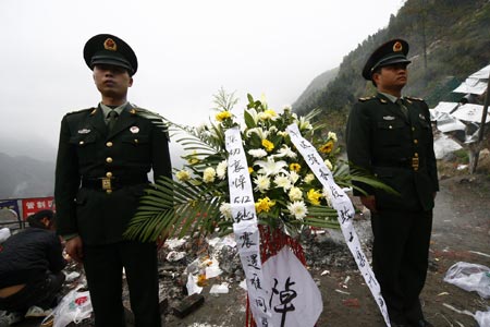 Two soldiers memorize the victims died in May 12 Earthquake, in Beichuan, a quake-jolted county of southwest China's Sichuan Province, on April 2, 2009. The ruined city of Beichuan County, once closed to avert pestilence, is opened to the public from April 1 to 4 so that people could offer sacrifices to their deceased relatives and friends in the May 12 Earthquake. 