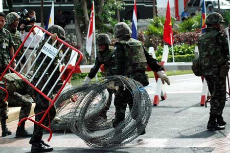 Soldiers place a barricade at the front gate of the Royal Cliff Beach Resort Hotel, the venue of the 14th ASEAN Summit and Related Summits, in Pattaya, Thailand, on April 11, 2009. 