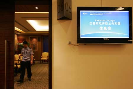 A policemen does security inspection at the Pakistan Lounge for the upcoming Boao Forum for Asia (BFA) Annual Conference 2009, in Boao, a scenic town in south China's Hainan Province, on April 16, 2009. 