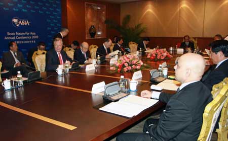 Delegates attend the Boao Forum for Asia (BFA) Board of Directors Meeting, in Boao, a scenic town in south China's Hainan Province, on April 16, 2009. The 3-day BFA Annual Conference 2009 will kick off here on Friday with the theme of 'Asia: Managing Beyond Crisis.'