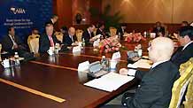 Delegates attend the Boao Forum for Asia (BFA) Board of Directors Meeting, in Boao, a scenic town in south China's Hainan Province, on April 16, 2009. The 3-day BFA Annual Conference 2009 will kick off here on Friday with the theme of 'Asia: Managing Beyond Crisis.'