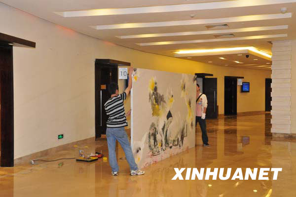 Workers make preparations at the venue of the Boao Forum for Asia (BFA) Annual Conference 2009, in Boao, a scenic town in south China's Hainan Province, on April 16, 2009. The 3-day BFA Annual Conference 2009 will kick off here Friday with the theme of 'Asia: Managing Beyond Crisis.' 