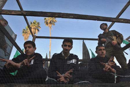 Palestinians act as prisoners to call for the release of the Palestinian prisoners held in Israeli jails during a demonstration in Gaza City, on April 16, 2009.