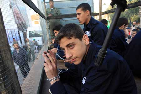 Palestinians attend a demonstration held by Hamas movement, calling for the release of Palestinian prisoners in Israeli jails in Gaza City, on April 16, 2009.