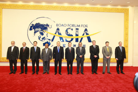 Leaders take a family photo before the opening plenary of Boao Forum for Asia (BFA) Annual Conference 2009 in Boao, a scenic town in south China's Hainan Province, on April 18, 2009. The BFA Annual Conference 2009 opened in Sanya on Saturday with the theme of 'Asia: Managing Beyond Crisis'. 