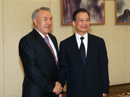 Chinese Premier Wen Jiabao (R) meets with Kazakhstan's President Nursultan Nazarbayev in Sanya, south China's Hainan Province, on April 17, 2009. Nazarbayev arrived here to attend the Boao Forum for Asia (BFA) Annual Conference 2009 which would be held in Boao, Hainan from April 17 to 19.