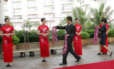 Staff members prepare garlands for greeting VIP guests upon their arrival at the Boao Forum for Asia (BFA) International Conference Center in Boao, south China's Hainan Province, on April 17, 2009.