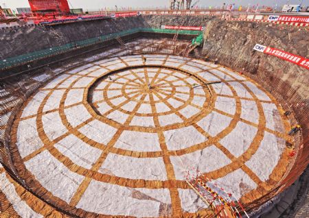 Photo taken on April 18, 2009 shows the foundational construction site of the No.1 unit of the first phase of the Sanmen nuclear plant in Zhejiang Province. The Sanmen nuclear plant, with the world's first nuclear plant using the AP1000 technologies, a type of third generation nuclear power reactor introduced by America's Westinghouse company, started the construction recently. 