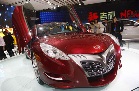 Visitors look at a concept sports car of Geely at the Shanghai auto expo in Shanghai, east China, on April 20, 2009. The 13th Shanghai auto expo opened on Monday to the media. The event has attracted over 1,500 domestic and foreign automakers.