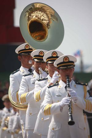 Members of the North China Sea Fleet Military Band of Chinese People's Liberation Army Navy attend a performance in Qingdao, east China's Shandong Province, on April 21, 2009.