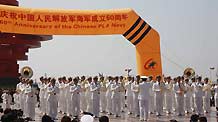 Members of the North China Sea Fleet Military Band of Chinese People's Liberation Army Navy attend a performance in Qingdao, east China's Shandong Province, on April 21, 2009. Eight military bands from seven countries attended the performance.