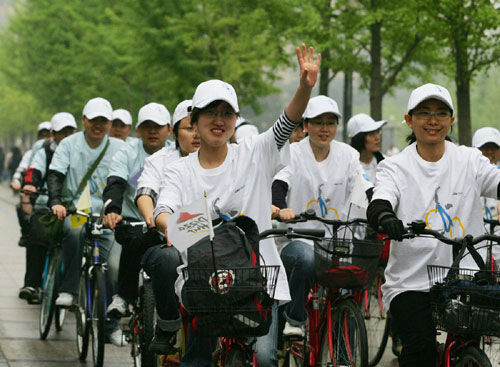 About 100 university students ride bicycles and go on a three-hour 'green trip' around the Haidian District in Beijing on April 22, 2009. The Earth Day, celebrated on every April 22, is a day designed to inspire people's awareness and appreciation for the Earth's environment. 