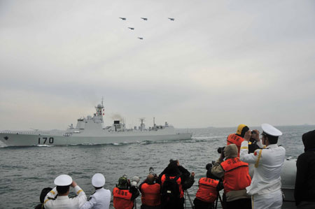 A naval parade of the Chinese People's Liberation Army (PLA) Navy warships and aircraft is held in waters off China's port city of Qingdao, east China's Shandong Province, on April 23, 2009. 