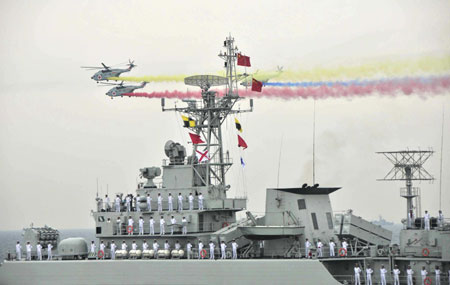 A naval parade of the Chinese People's Liberation Army (PLA) Navy warships and aircraft is held in waters off China's port city of Qingdao, east China's Shandong Province, on April 23, 2009. 