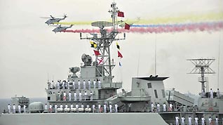A naval parade of the Chinese People's Liberation Army (PLA) Navy warships and aircraft is held in waters off China's port city of Qingdao, east China's Shandong Province, on April 23, 2009.