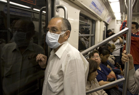 A man wears a mask as he takes subway in Mexico City, capital of Mexico, on April 24, 2009. 